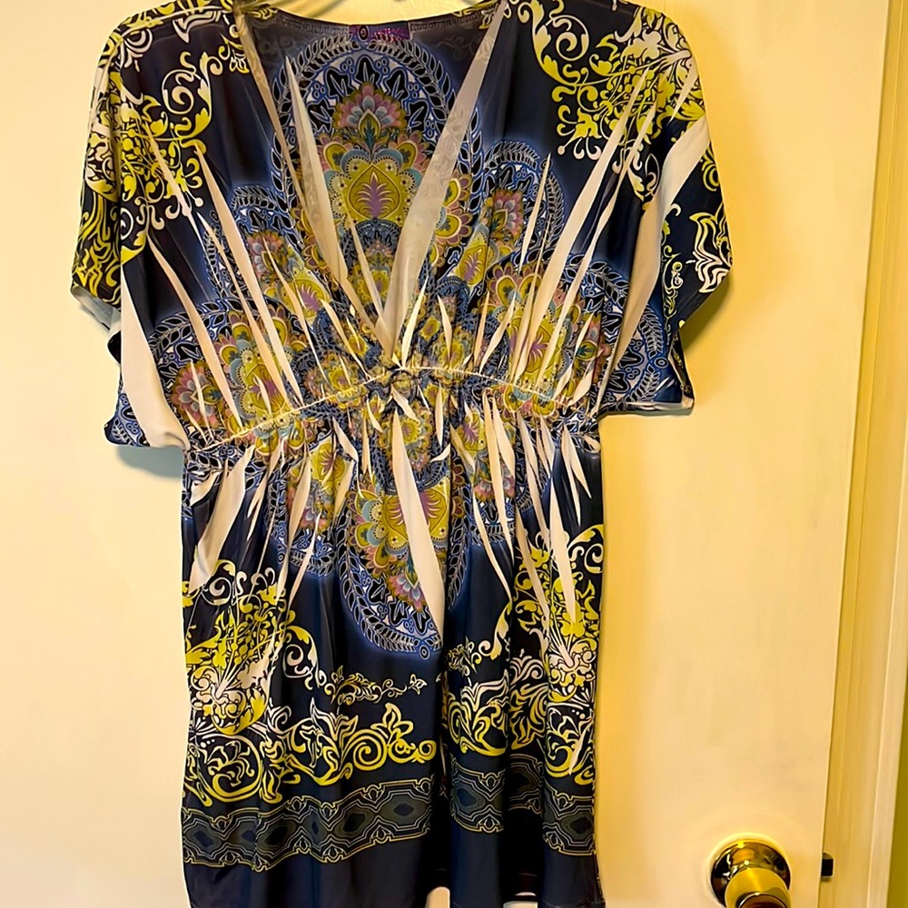 Very pretty short sleeved top, size large. Plunging v neck and multi colored.